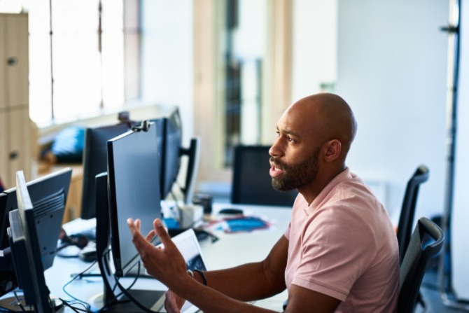 A man sitting a computer